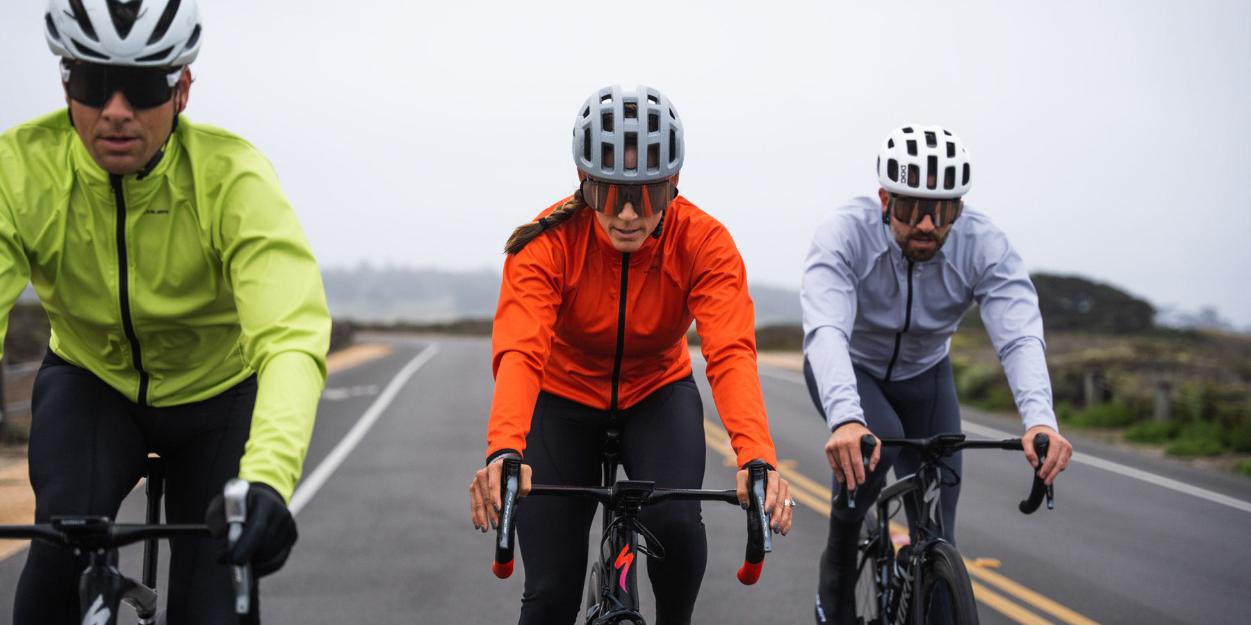 cyclists wearing thermal jackets in 3 colors