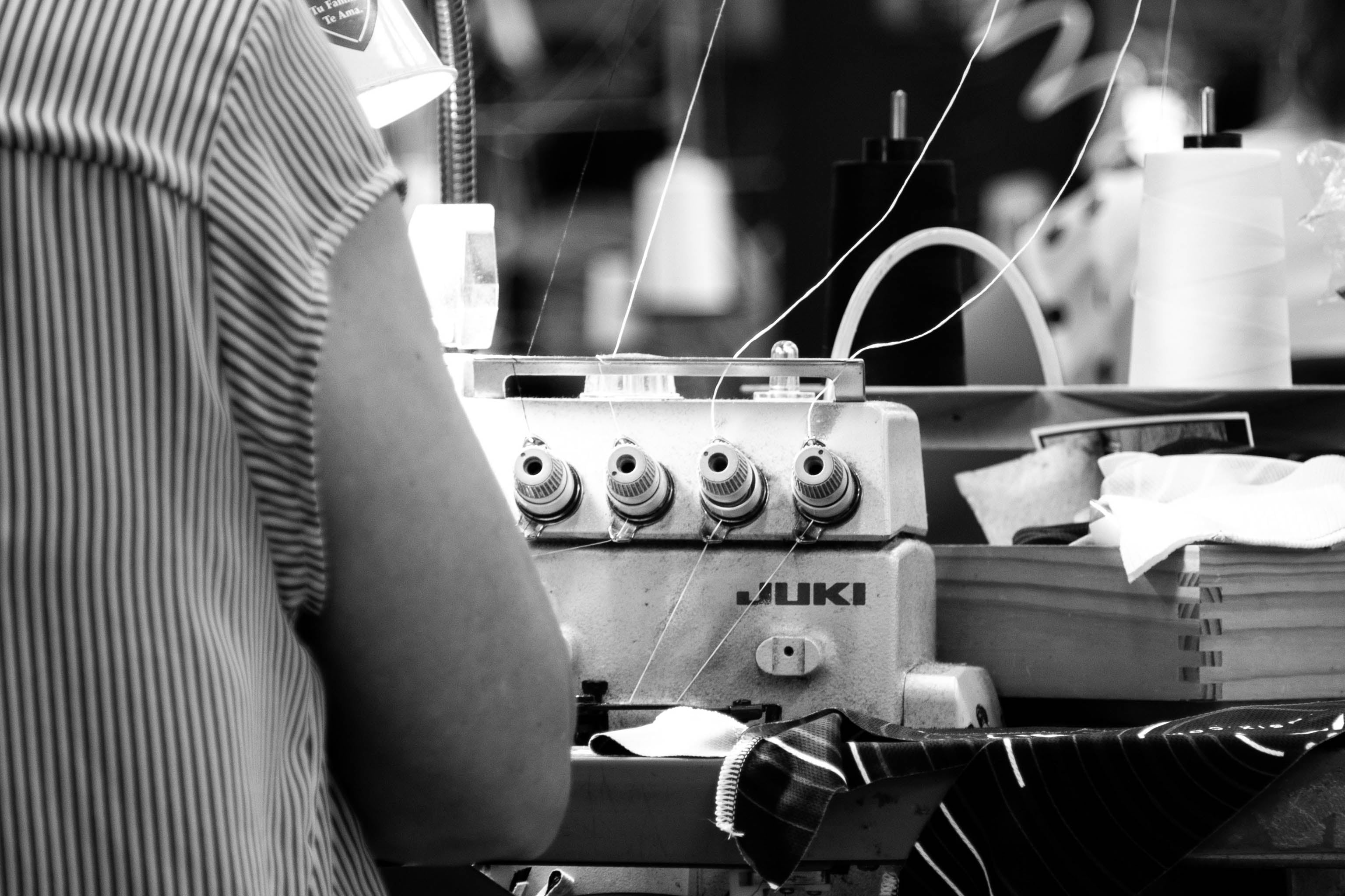 sewing machine and operator in Voler Factory