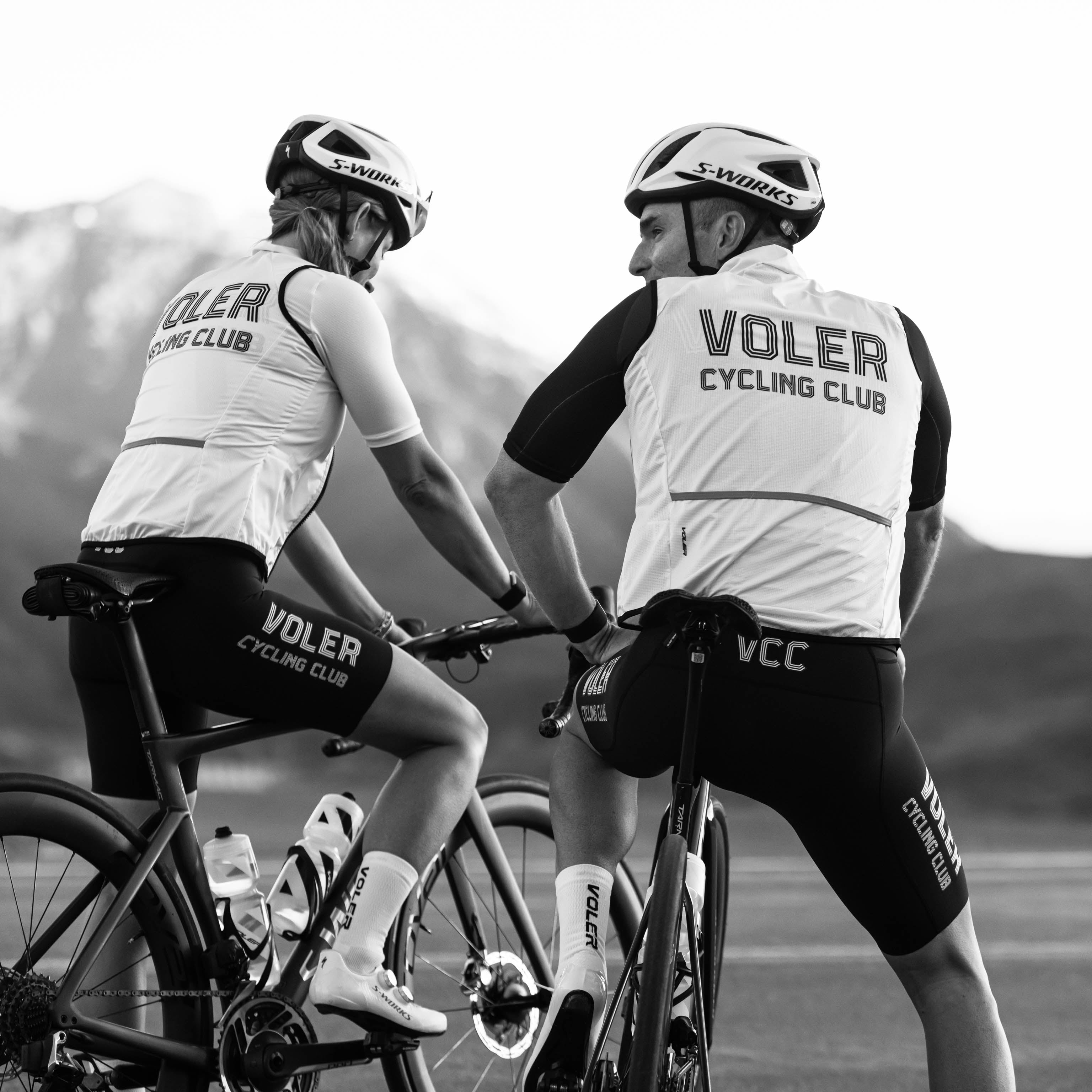 back shot of two cyclists wearing VCC kits