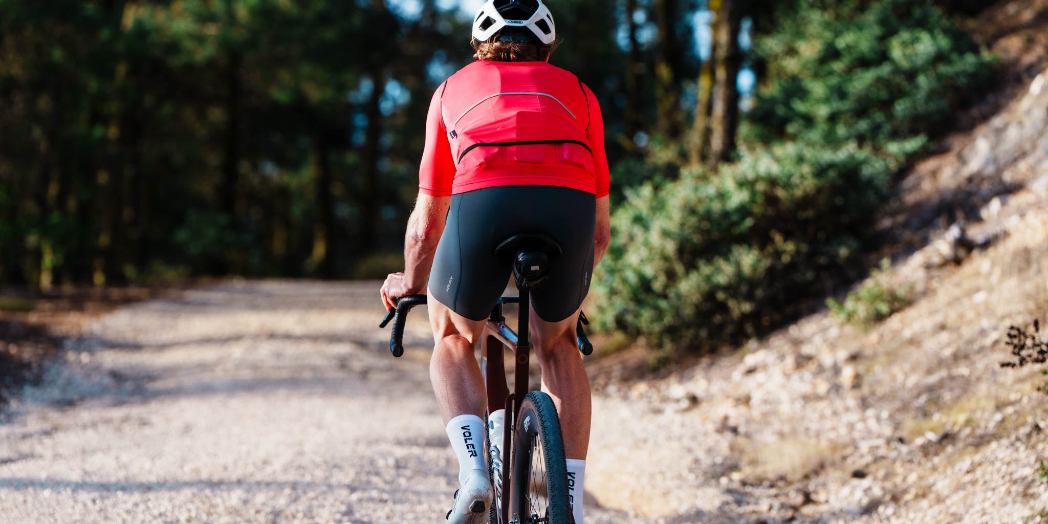 male cyclist in red jersey
