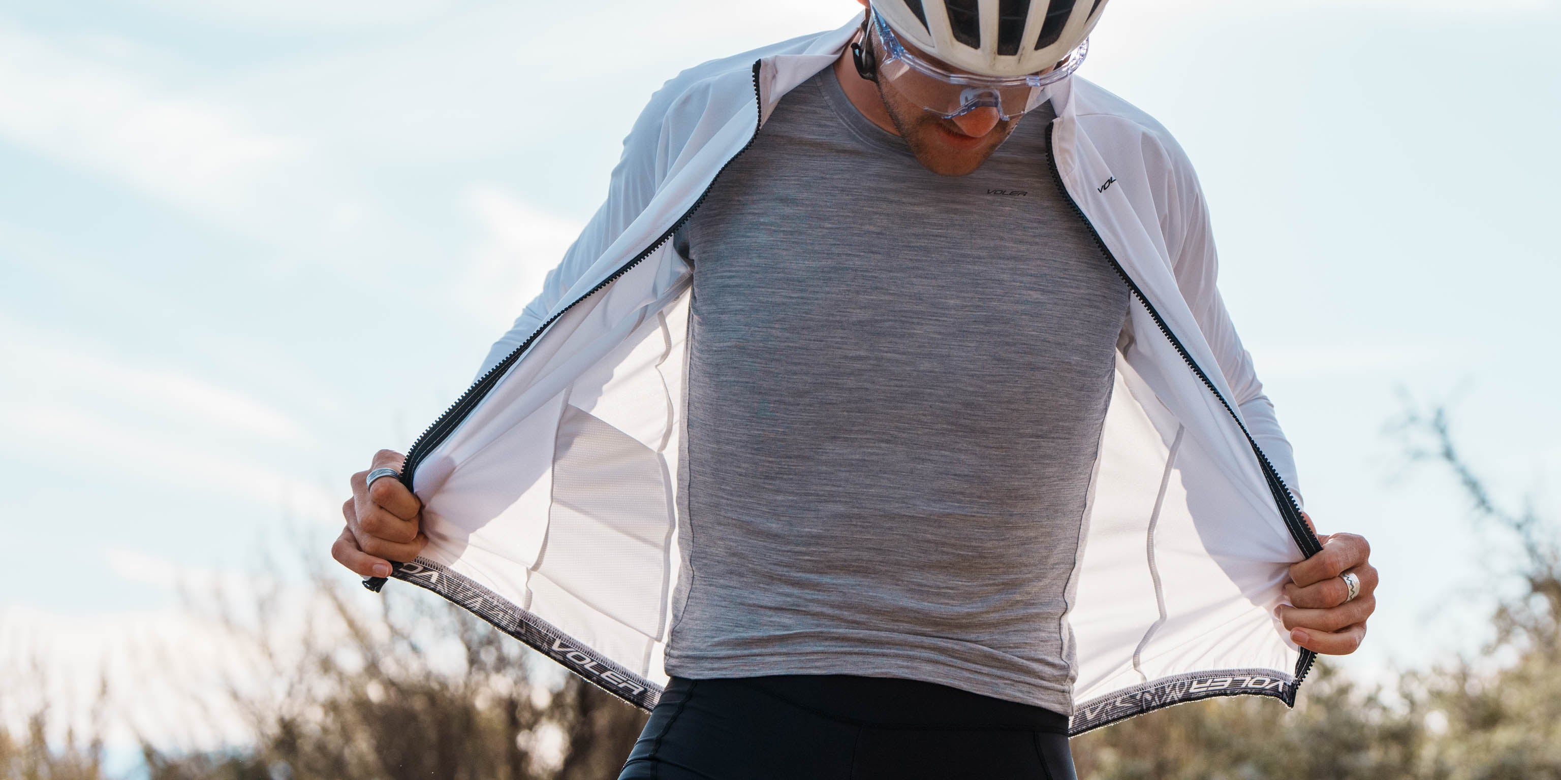 Cyclist with jacket unziped