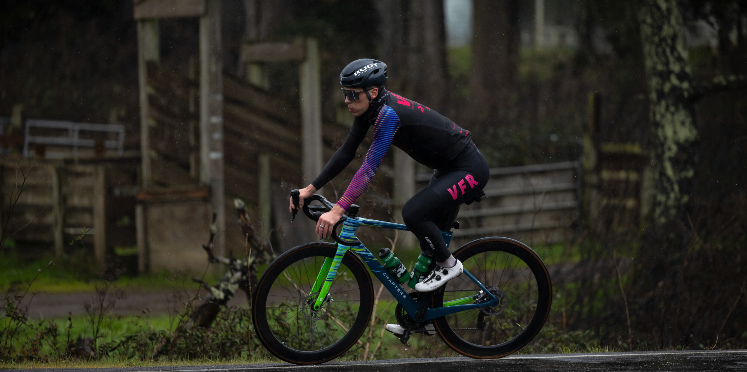 A Voler Factory Racing rider cycling in the rain